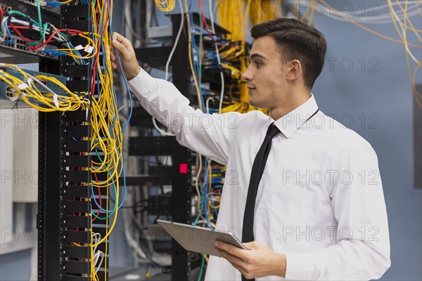 Young business engineer with tablet medium shot
