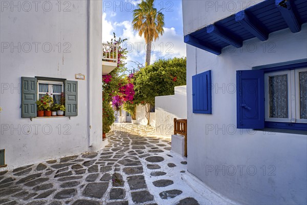 Romantic traditional narrow streets and beautiful walkways of Greek island towns. Whitewashed houses