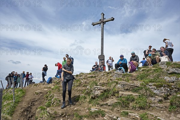 Many hikers rest at the summit of the Rotwand