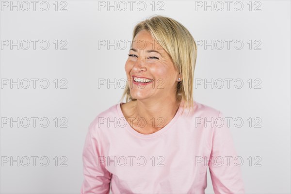 Senior laughing woman rose blouse