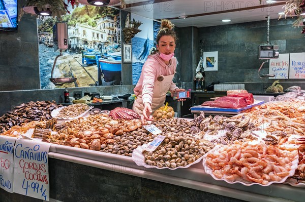 Saleswoman at the seafood stall
