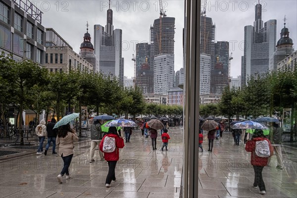 Passers-by walk along the Zeil in Frankfurt am Main during rainy weather. The summer of 2023 has so far proven to be very rainy compared to previous years.