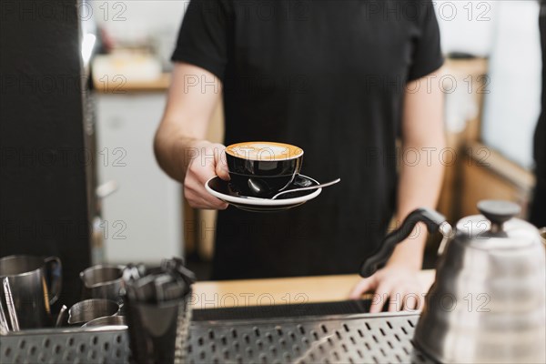 Bar concept man holding coffee