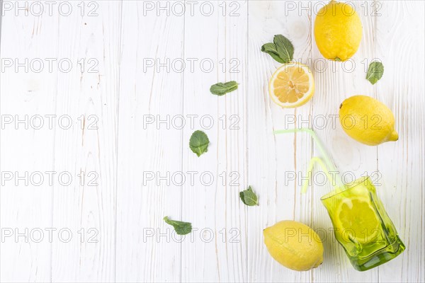 Lemons bright colored glass with straw