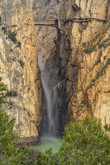 Suspension bridge and waterfall of the via ferrata Caminito del Rey near El Chorro