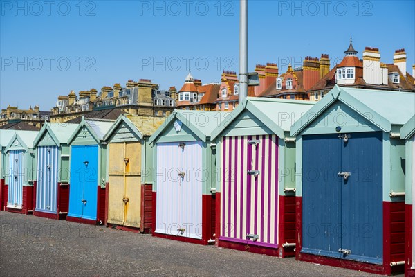 Row of beautiful colourful seaside bathing cottages in Brighton and Hove