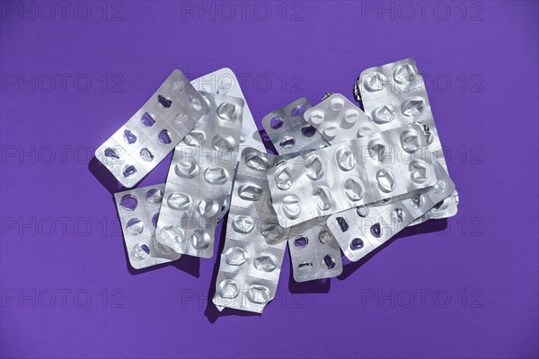 Empty tablet blister pack against a monochrome background