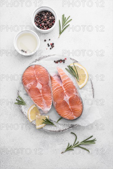 Slices fresh salmon slices white plate