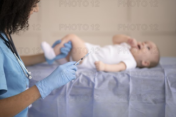 Little baby being health clinic vaccination1