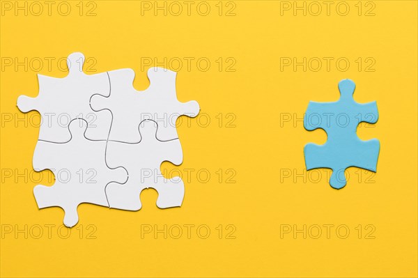 Joint white puzzle blue single piece yellow surface