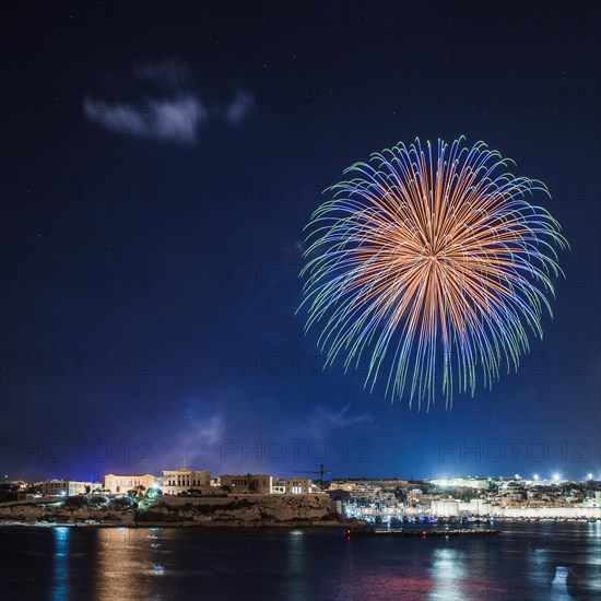 Coastal town with fireworks
