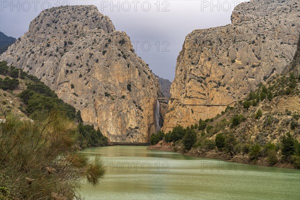 Suspension bridge and waterfall of the via ferrata Caminito del Rey near El Chorro