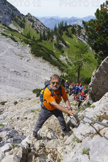 Climbers on the Widauersteig via ferrata at Scheffauer