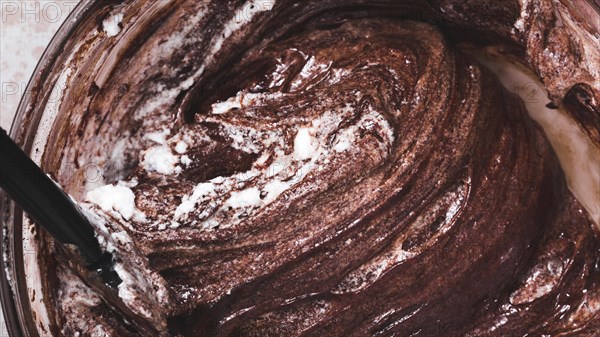 Close up mixed chocolate cake dough bowl
