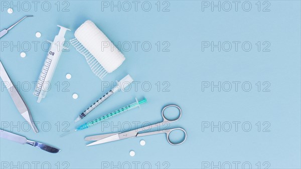 Overhead view medical equipment s blue background