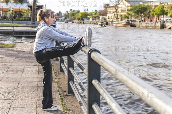 Mature woman doing stretching exercise