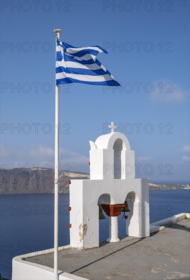 Whitewashed belfry and Greek national flag