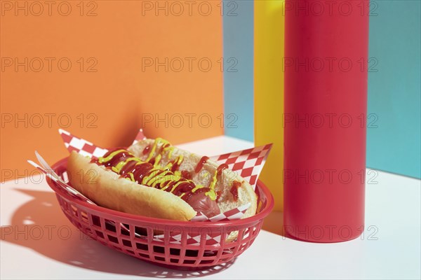 Arrangement with hot dog basket sauce bottles