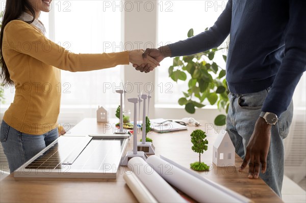 Colleagues handshake close up