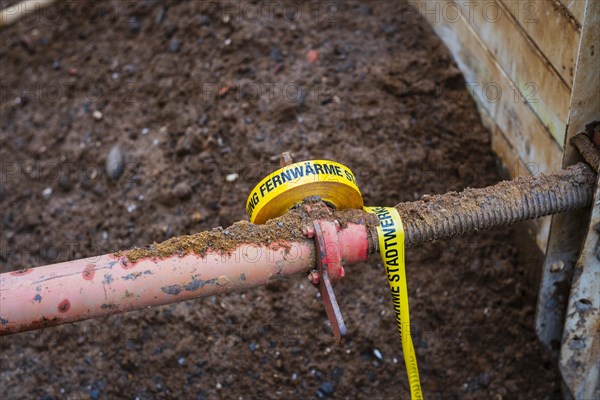 Flutter tape with the inscription Fernwaerme at a construction site in Duesseldorf