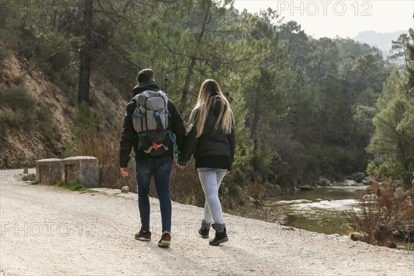 Couple with backpack exploring nature 6