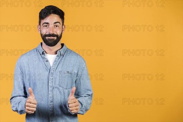 Medium shot guy holding thumbs up