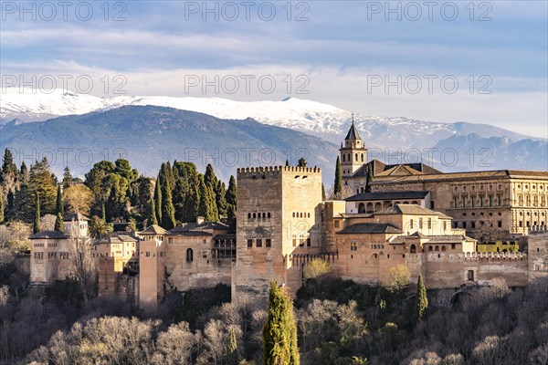 View from the Mirador de San Nicolas of Alhambra and the snow-capped mountains of the Sierra Nevada