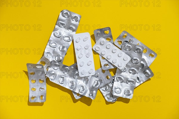 Empty tablet blister pack against a monochrome background