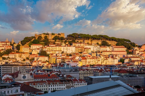 View of Lisbon city from Miradouro de Sao Pedro de Alcantara viewpoint on sunset. Lisbon