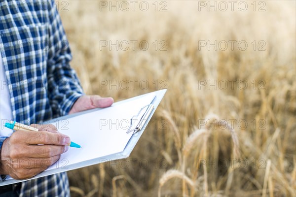 Man taking notes clipboard