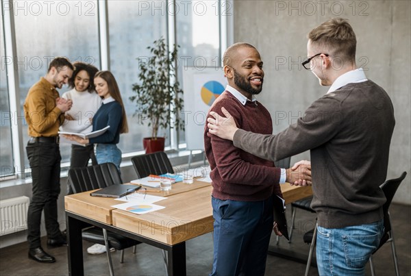 Men handshaking agreement after meeting