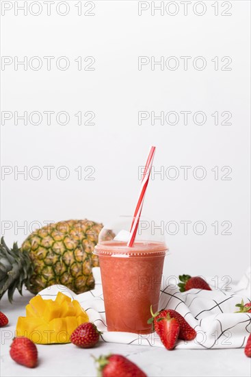 Cup delicious strawberry smoothie