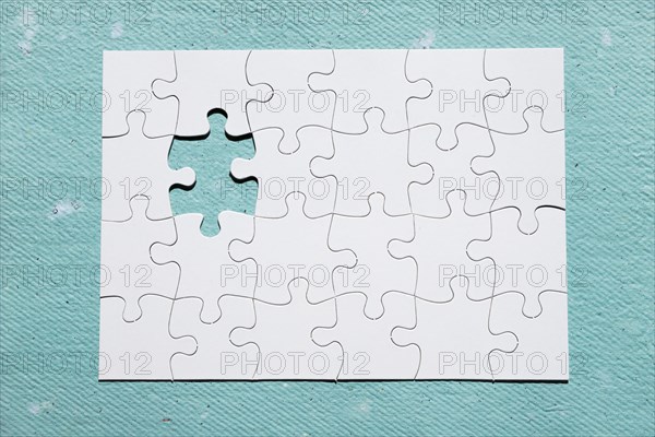 Missing piece puzzle blue textured backdrop