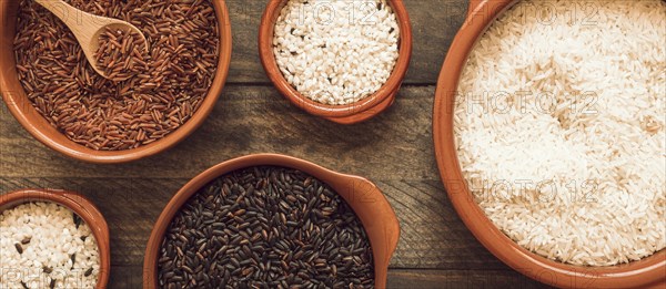 Red brown white rice bowls wooden background