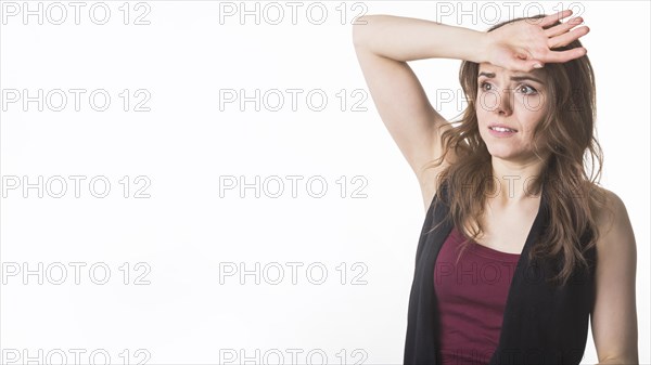 Worried young woman white background