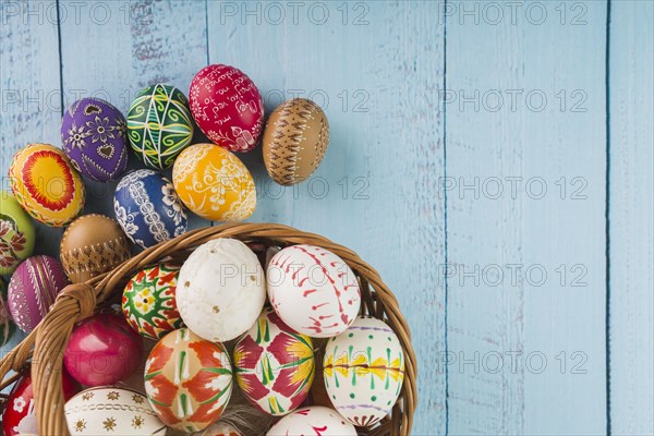 Colored eggs wicker basket