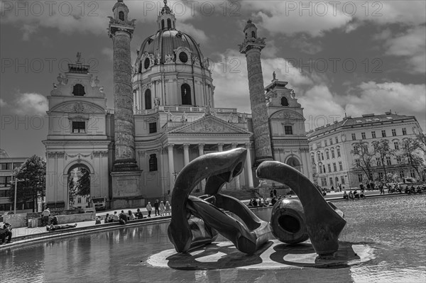 Bronze sculptures in the pond in front of the baroque Karlskirche