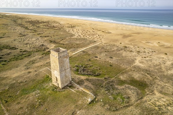 The Torre Vigia de Castilnovo tower at Playa de Castilobo beach