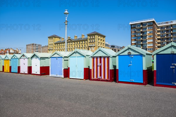 Row of beautiful colourful seaside bathing cottages in Brighton and Hove