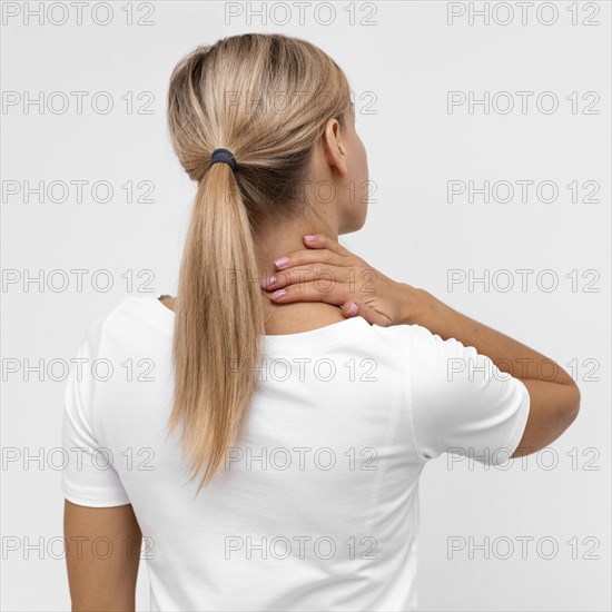 Back view woman with neck pain