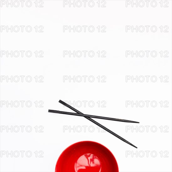Empty red bowl chopstick isolated white background