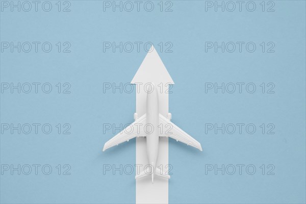 Flat lay arrow airplane direction