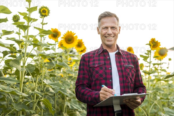 Medium view man with clipboard field