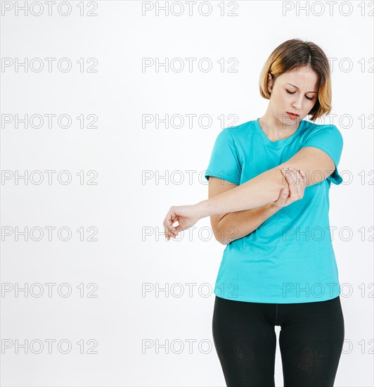 Pretty woman with hurting elbow