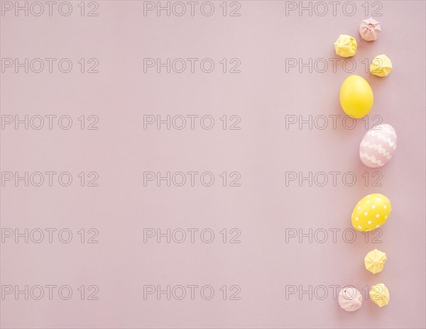 Colourful easter eggs with sweets table