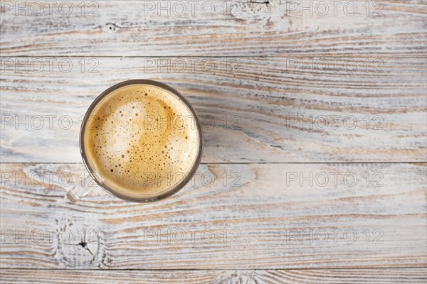 Flat lay cup coffee with foam