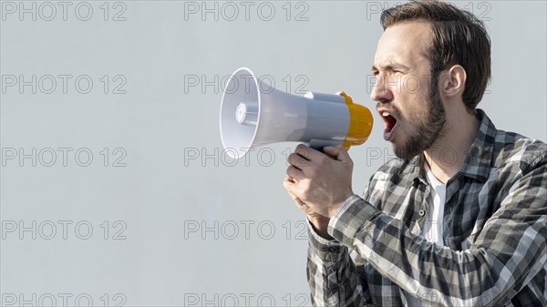 Front view young man with megaphone