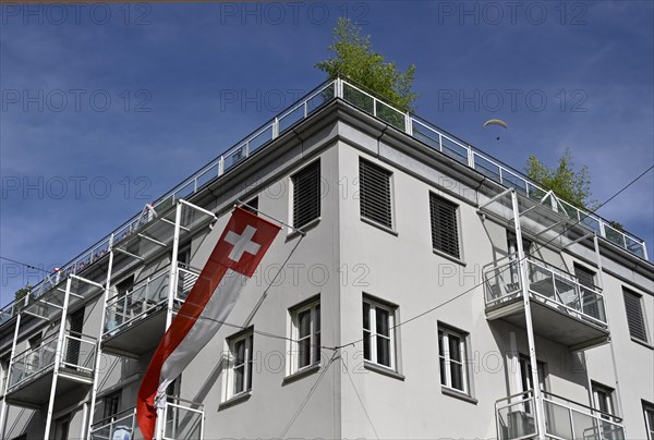 Multi-family house Swiss flag