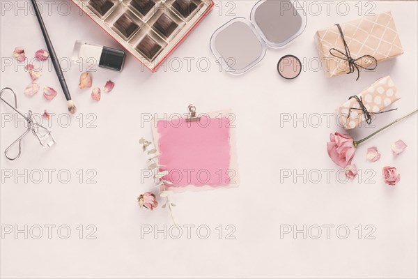 Blank paper with gift boxes roses cosmetics