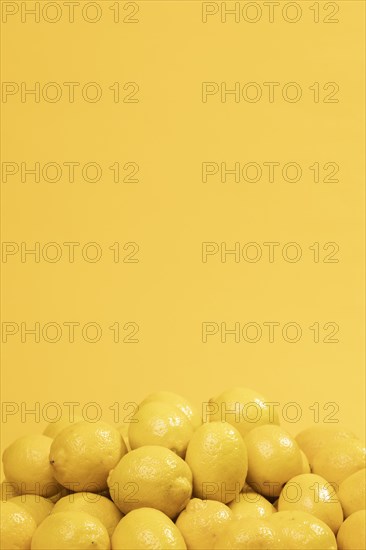 Bunch raw lemons with copy space